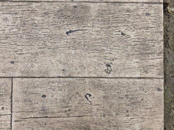 Weathered wood-plank stamped concrete texture by General Maintenance Works in Macomb County
